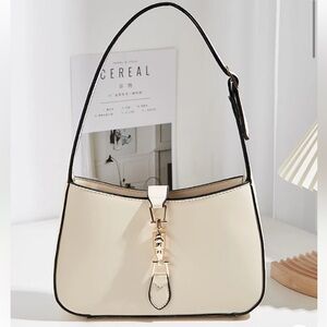 Elegant Single-shoulder Bag With Contrast Binding And Metal Decoration